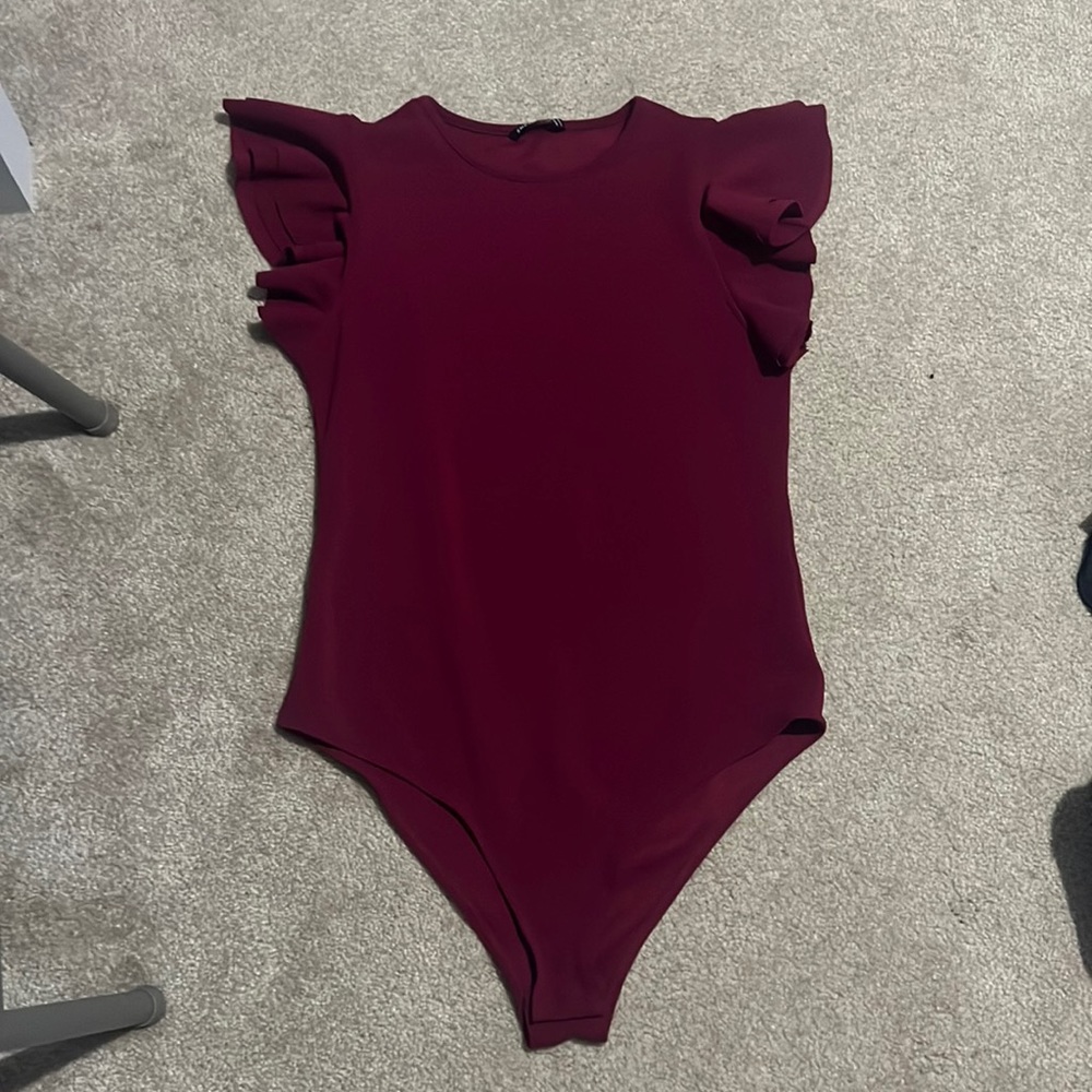 Women’s burgundy bodysuit.
